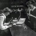 Two Girls with a Microscope